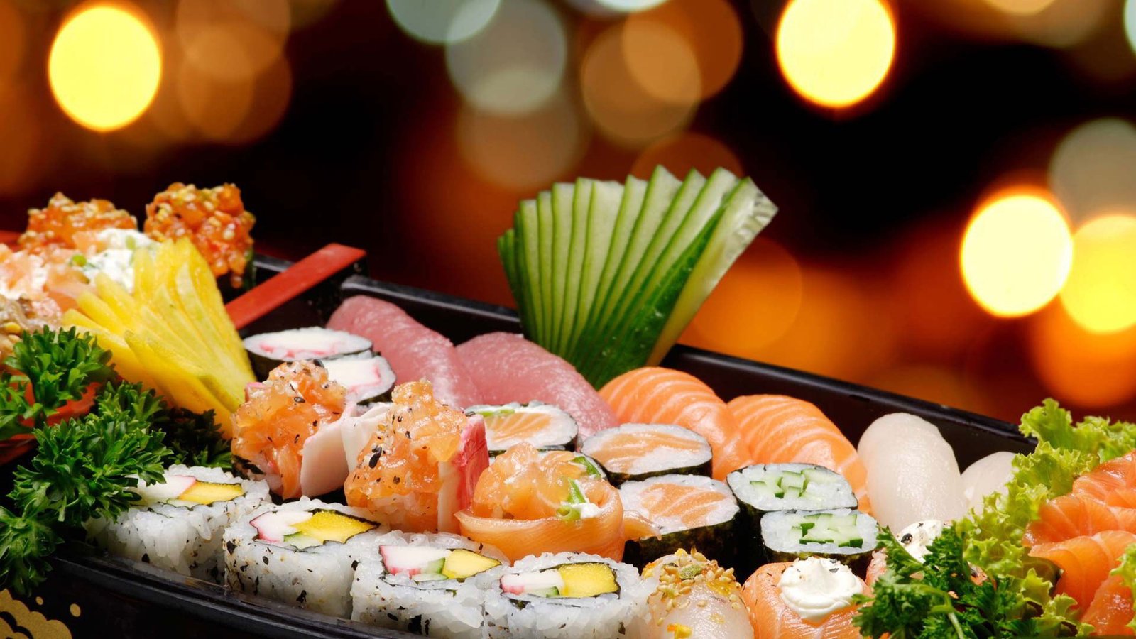 Colorful sushi platter with rolls, nigiri and sashimi